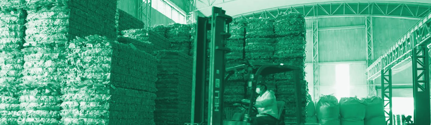 Stacked bales of post-consumer PET, green duotone