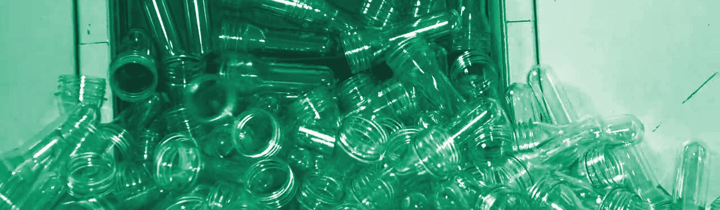 Clear PET preforms ready for market, green duotone