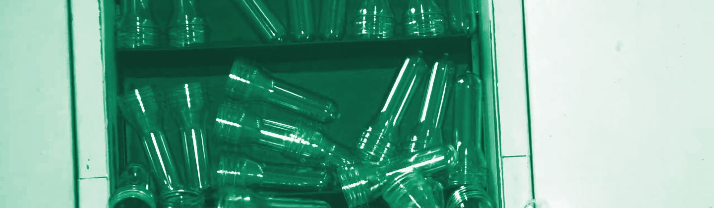 Ordered racks of PET preforms, green duotone